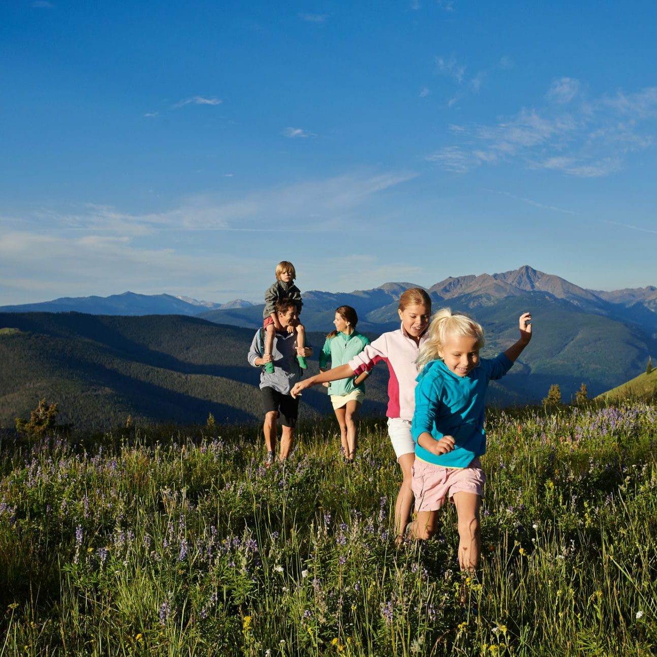 Family hiking on a Colorado mountaintop